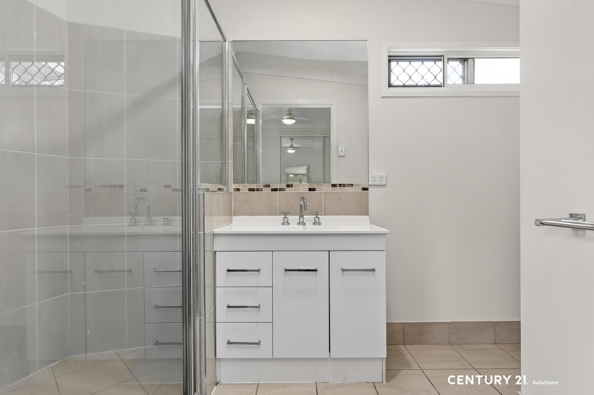 Ensuite. Fully tiled shower, vanity, toilet.